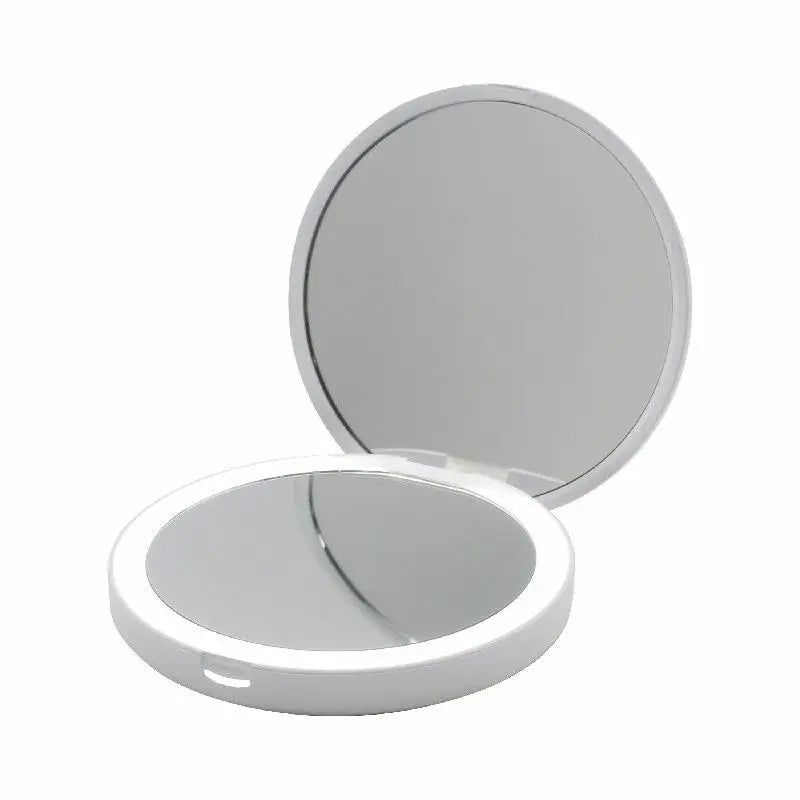 Compact mirror with two reflective surfaces on a white background