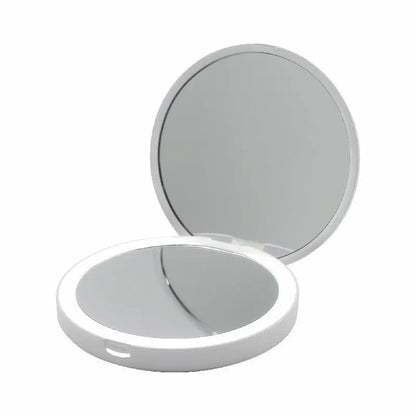 Compact mirror with two reflective surfaces on a white background