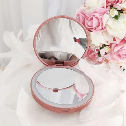 Pink compact mirror with floral background